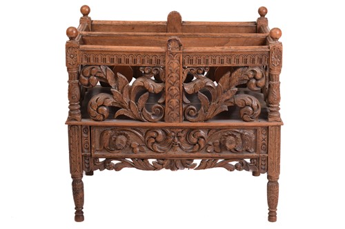 Lot 137 - A Victorian carved oak Canterbury, the two...