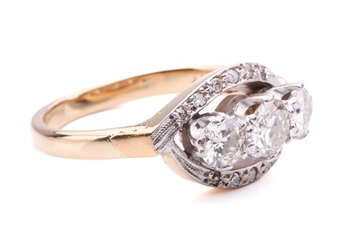 Lot 9 - A three-stone diamond crossover ring,...