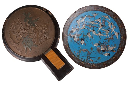 Lot 75 - A lacquer-cased Japanese bronze mirror, with...