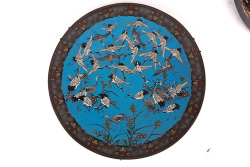 Lot 75 - A lacquer-cased Japanese bronze mirror, with...