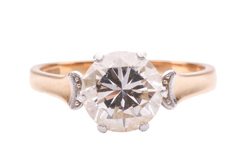 Lot 69 - A diamond solitaire ring, set with a round...