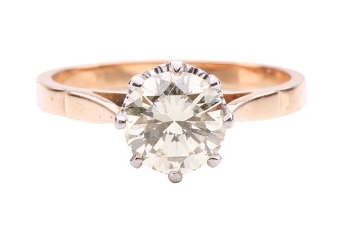 Lot 94 - A diamond solitaire ring set with a light...