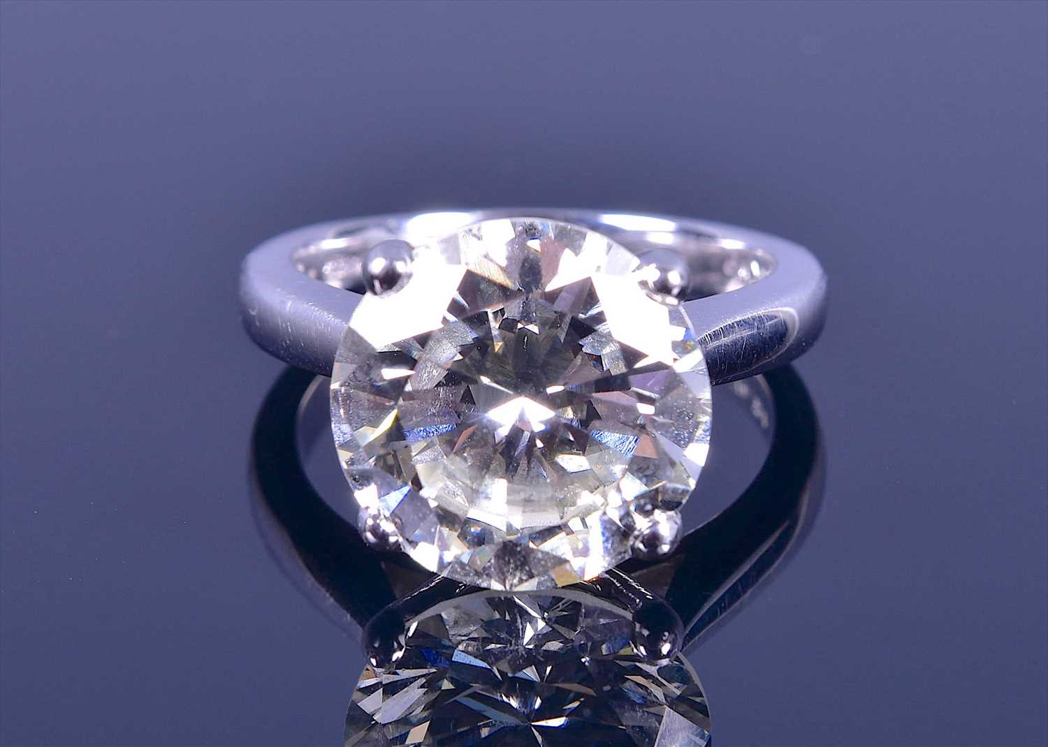 Lot 555 - An impressive 18ct white gold and solitaire...