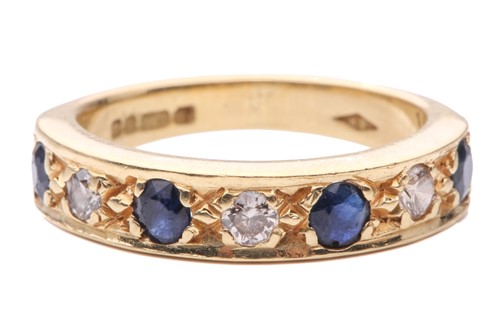 Lot 76 - A sapphire and diamond half-eternity ring in...