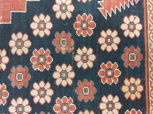 Lot 179 - An antique Armenian Erivan rug with red ground...