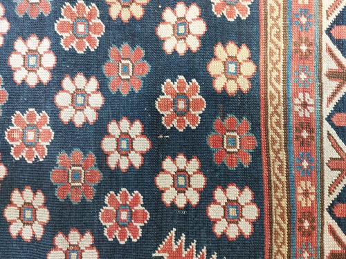 Lot 179 - An antique Armenian Erivan rug with red ground...