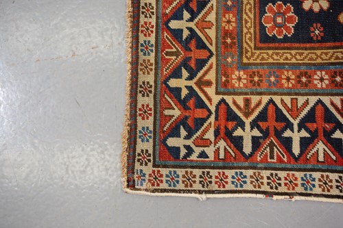 Lot 179 - An antique Armenian Erivan rug with red ground...