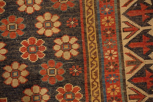 Lot 179 - An antique Armenian Erivan rug with red ground...