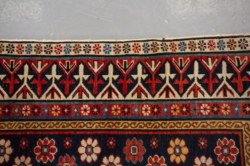 Lot 179 - An antique Armenian Erivan rug with red ground...