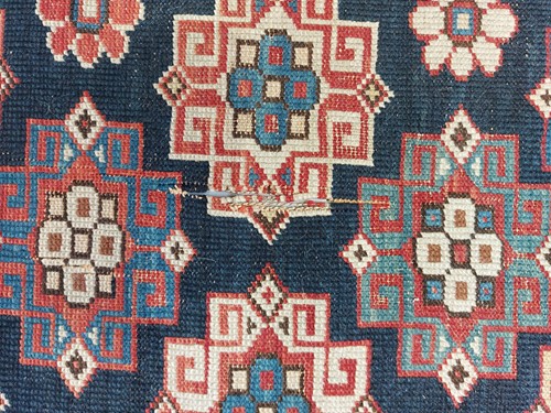 Lot 179 - An antique Armenian Erivan rug with red ground...