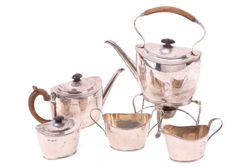 Lot 310 - An Edwardian silver five-piece tea service, in...