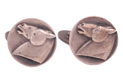 Lot 192 - Georg Jensen - a pair of cufflinks depicting a...