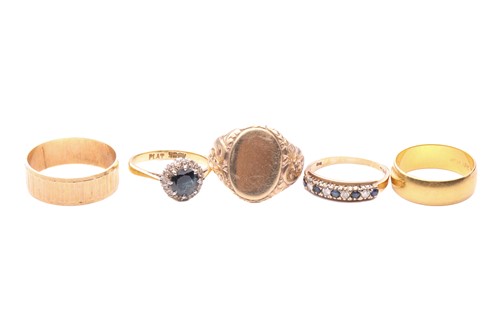 Lot 161 - A collection of five rings; to include a...