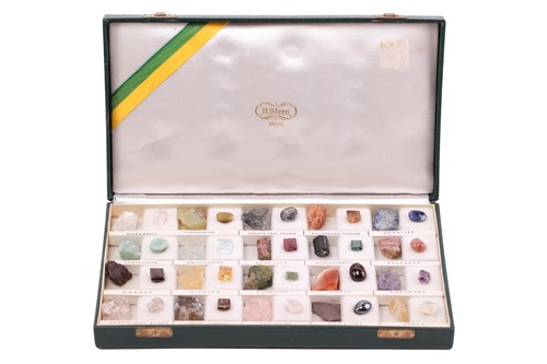 Lot 64 - A case of gem and mineral specimens, featuring...