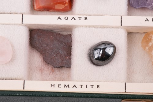 Lot 64 - A case of gem and mineral specimens, featuring...