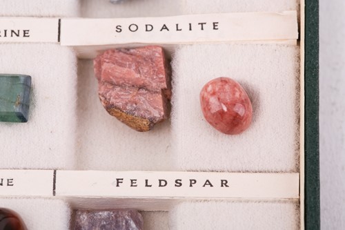 Lot 64 - A case of gem and mineral specimens, featuring...