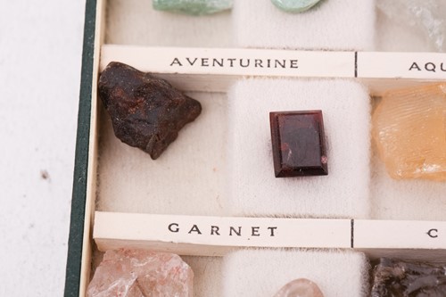 Lot 64 - A case of gem and mineral specimens, featuring...