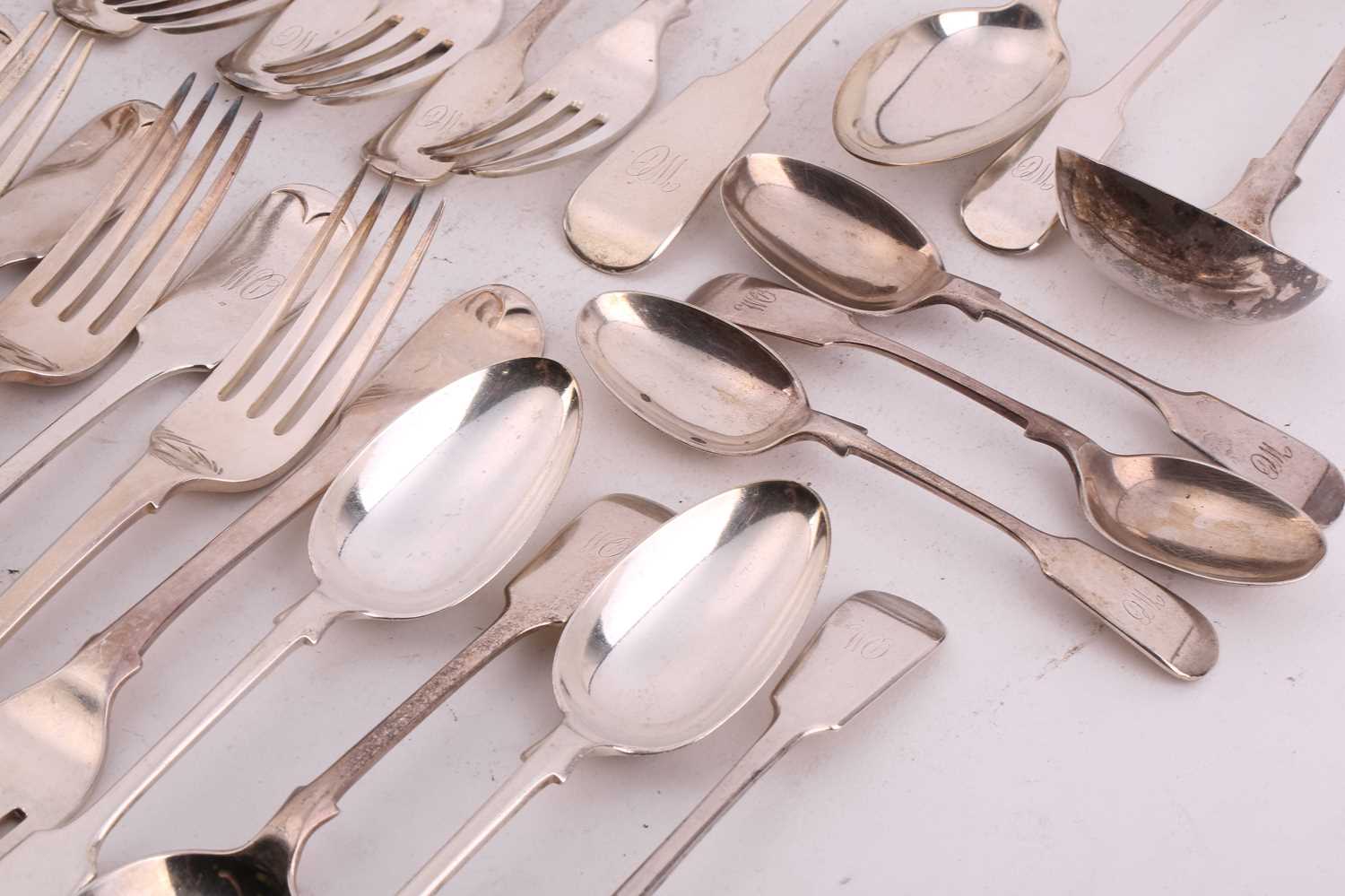 Lot 320 - A mixed canteen of fiddle pattern flatware,