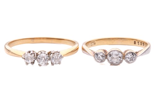 Lot 142 - Two diamond three-stone rings; the first set...