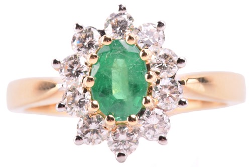 Lot 78 - An 18 carat gold, emerald and diamond cluster...