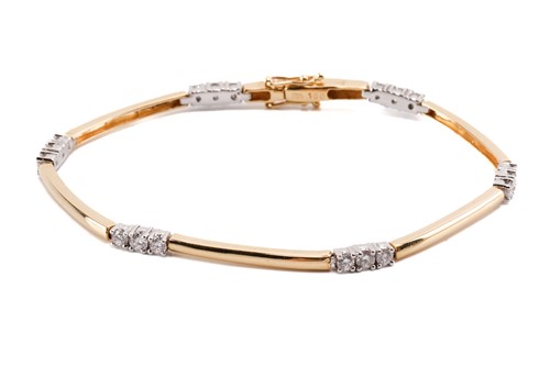 Lot 180 - An 18ct gold and diamond bracelet; bi-coloured...