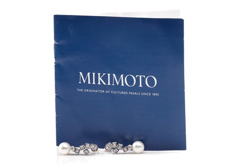 Lot 16 - Mikimoto. A pair of Mikimoto pearl and diamond...