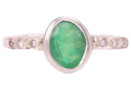 Lot 138 - A single stone emerald ring; the mixed oval...