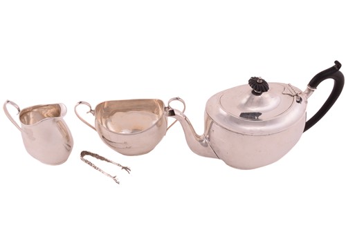 Lot 447 - A three-piece silver tea set; rounded...