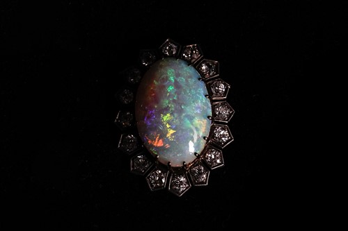 Lot 198 - A Victorian opal and diamond halo pendant,...