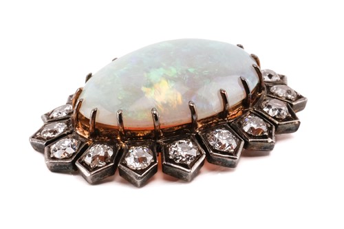 Lot 198 - A Victorian opal and diamond halo pendant,...