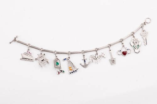 Lot 246 - An Art Deco-style gem-set charm bracelet,...