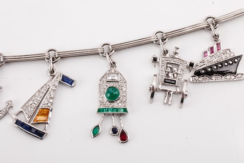 Lot 246 - An Art Deco-style gem-set charm bracelet,...