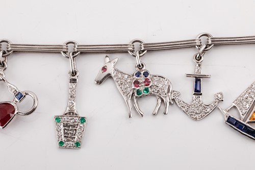 Lot 246 - An Art Deco-style gem-set charm bracelet,...