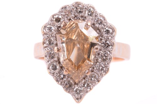 Lot 47 - A diamond cluster ring, set with a shield...