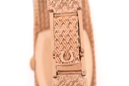 Lot 351 - An Omega Lady's dress watch in 9ct gold,...