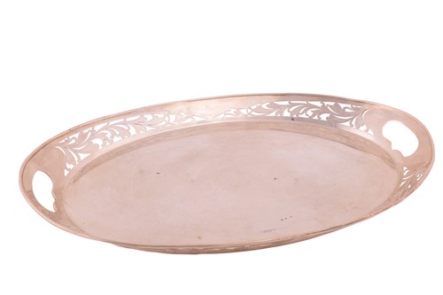 Lot 479 - A silver pierced oval gallery tea tray, with...