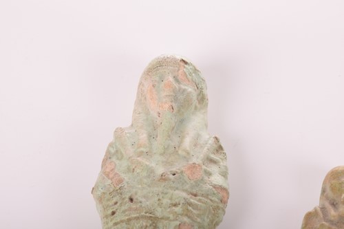 Lot 242 - An Egyptian faience shabti with a mottled...