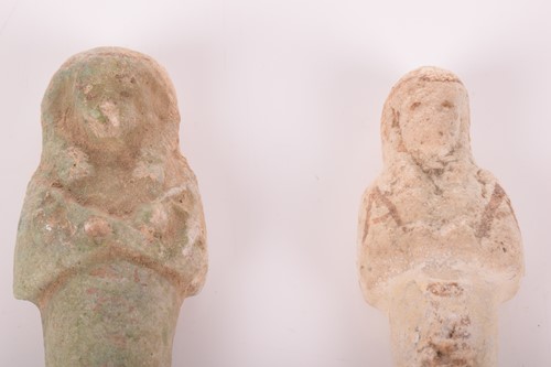 Lot 242 - An Egyptian faience shabti with a mottled...