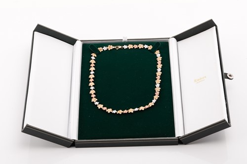 Lot 164 - A floral tri-colour necklace designed as a...