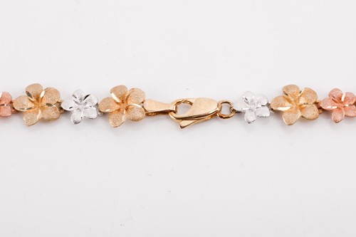 Lot 164 - A floral tri-colour necklace designed as a...