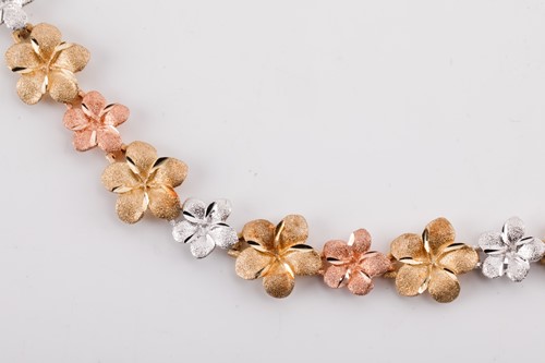 Lot 164 - A floral tri-colour necklace designed as a...