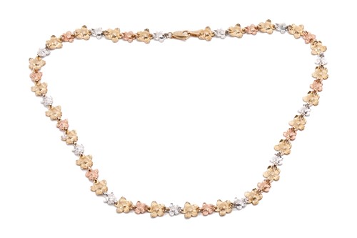 Lot 164 - A floral tri-colour necklace designed as a...