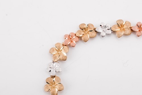 Lot 164 - A floral tri-colour necklace designed as a...