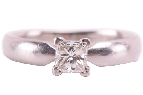 Lot 240 - A diamond solitaire ring set with a princess...