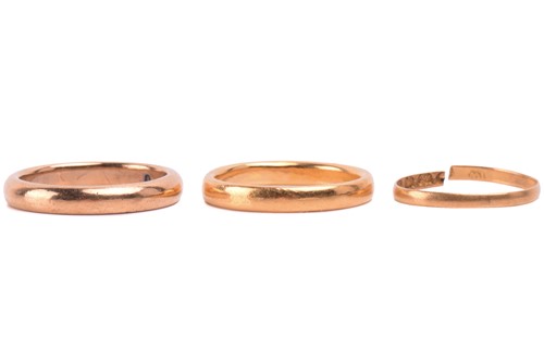 Lot 187 - Three 22ct gold rings, including a rose gold...
