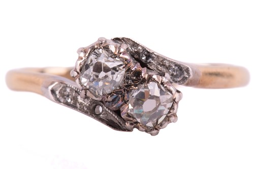 Lot 160 - A diamond cross-over ring, set with two old...