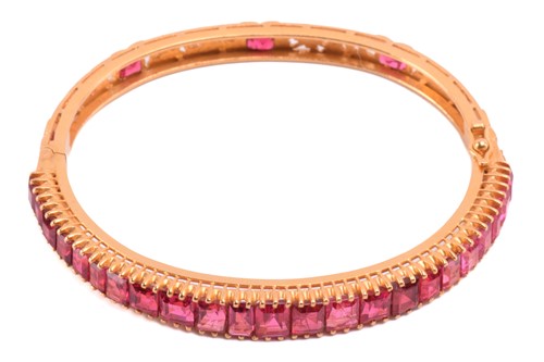 Lot 244 - A hinged bracelet set with pink spinels,...