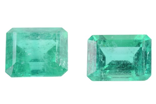 Lot 276 - Two loose emeralds; the larger with a weight...