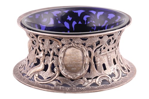 Lot 438 - An Irish silver dish ring with blue glass...