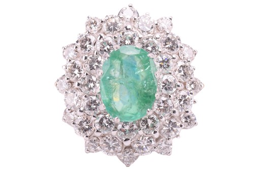 Lot 32 - An emerald and diamond cluster ring, the...